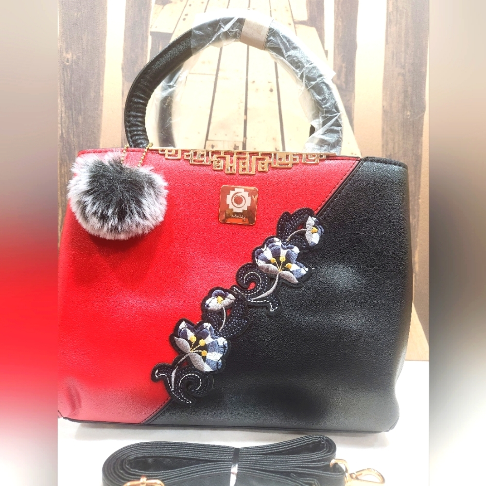Brand New Leather Woman Shoulder bag with flower design.